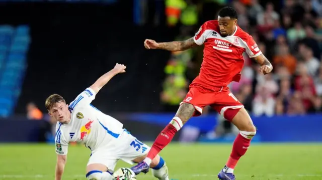 Leeds and Middlesbrough players challenge for the ball