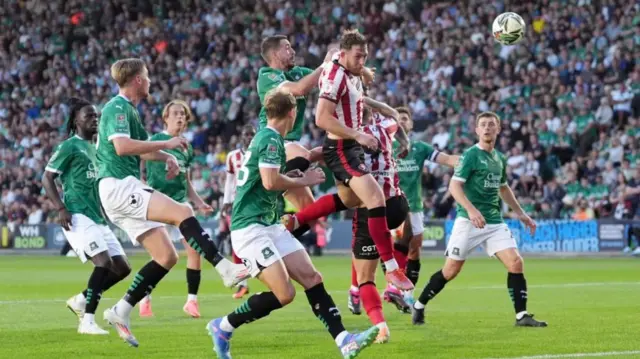 Cheltenham Town's Liam Dulson has a header on goal