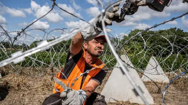 Ukraine is installing razor wire and anti-tank fortifications, known as 'dragon's teeth', in Sumy region near the border with Russia