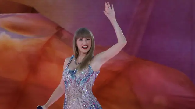 Taylor Swift waves on stage