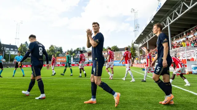 Kilmarnock's Brad Lyons, Joe Wright and Lewis Mayo walk out onto the pitch during a UEFA Conference League qualifying match between Tromso and Kilmarnock at the Romssa Arena, on August 15, 2024, in Tromso, Norway. (Photo by Craig Foy / SNS Group)