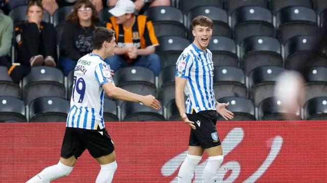 Charlie McNeill celebrates scoring for Sheffield Wednesday away to Hull City in the Carabao Cup