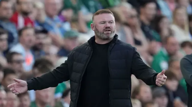 Plymouth manager Wayne Rooney signals to his players during their win over Cheltenham