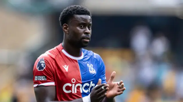 Crystal Palace's Marc Guehi applauds his side's travelling supporters at the end of the match during the Premier League match between Wolverhampton Wanderers and Crystal Palace at Molineux on May 11, 2024 in Wolverhampton, England.