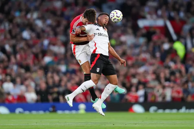 Rodrigo Muniz of Fulham battles for possession with Harry Maguire