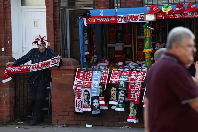 Scarves are displayed for sale on a merchandise stall near to the stadium