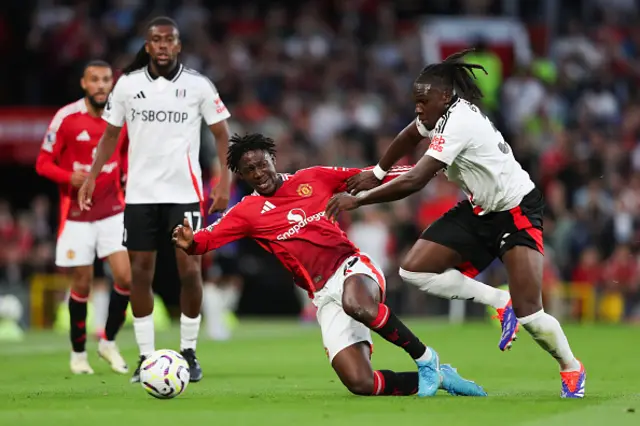 Kobbie Mainoo of Manchester United is fouled by Calvin Bassey