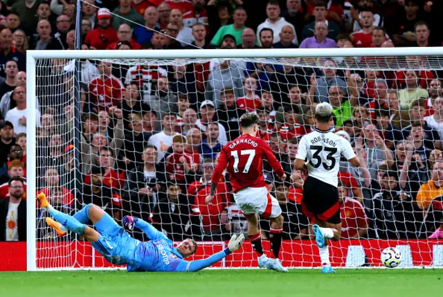 Bernd Leno of Fulham attempts to make a save as Alejandro Garnacho