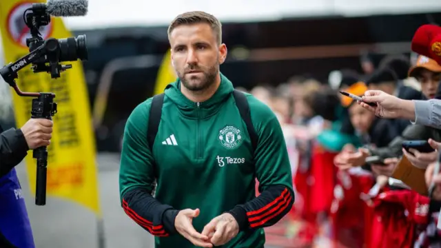 Luke Shaw of Manchester United arrives ahead of the Premier League match between Manchester United and West Ham United at Old Trafford on February 04, 2024 in Manchester, England.