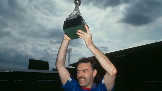 Scottish footballer John Wark of Ipswich Town raises the Division 2 championship trophy after a match against Brighton, 2nd May 1992. Ipswich won 3-1.