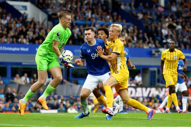 Pickford comes out to claim a cross