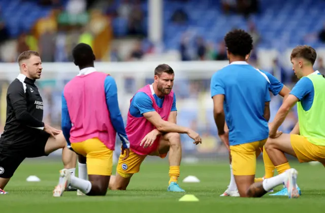 Brighton players stretch guided by Milner