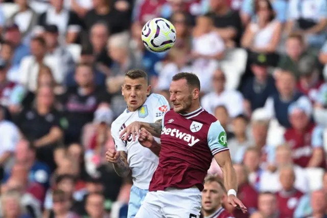 Digne and Coufal duel in the air