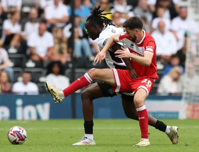 Middlesbrough's Finn Azaz (right) and Derby County's David Ozoh battle for the ball