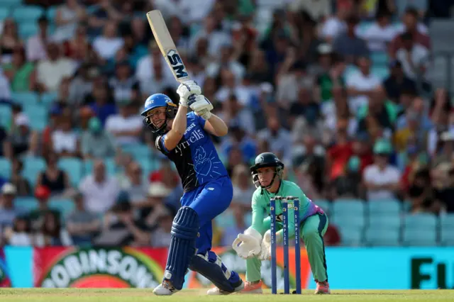 Heather Knight watches the ball after hitting it down the ground