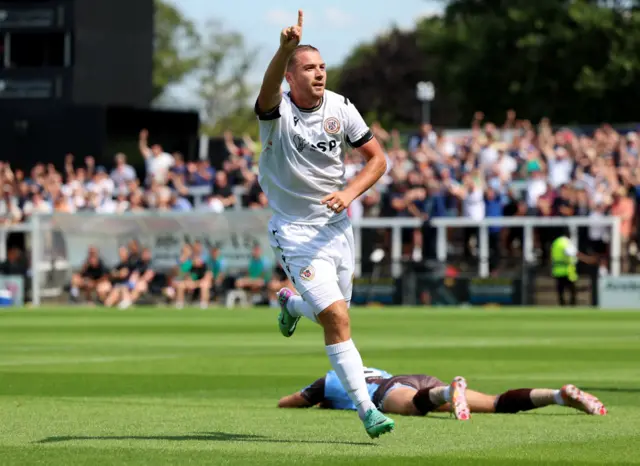 Michael Cheek celebrates