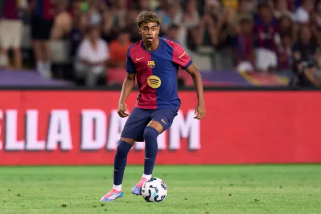 Barcelona winger Lamine Yamal with the ball at his feet