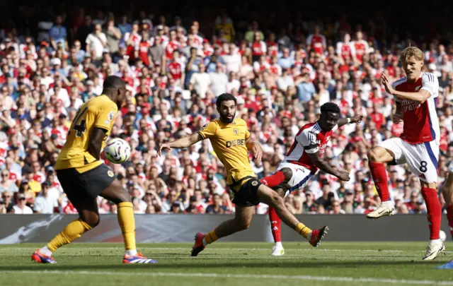 Saka cuts inside to score the second Arsenal goal