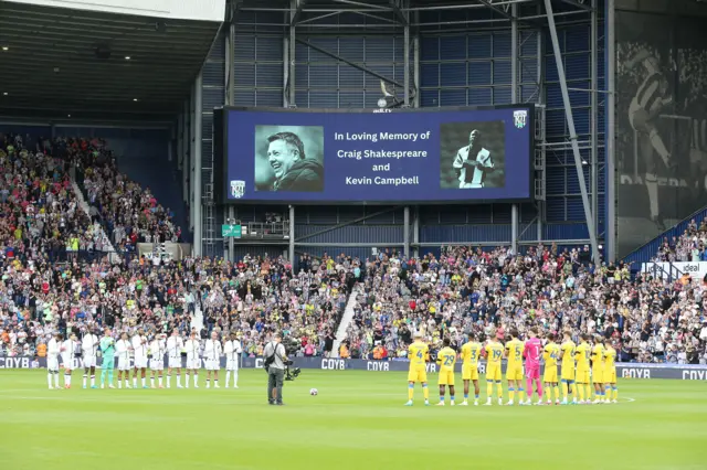 Players and fans stand for a minutes applause in memory of former manager Craig Shakespeare and player Kevin Campbell