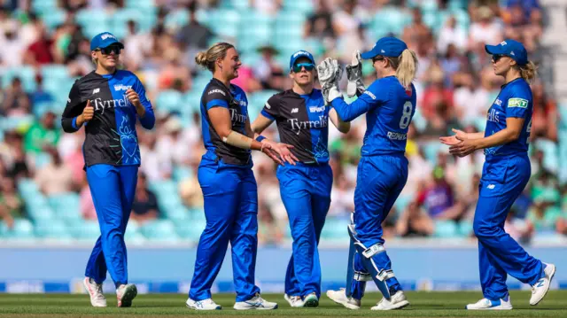 London Spirit Georgia Redmayne (centre right) celebrates with teammates after catching out Oval Invincibles Alice Capsey