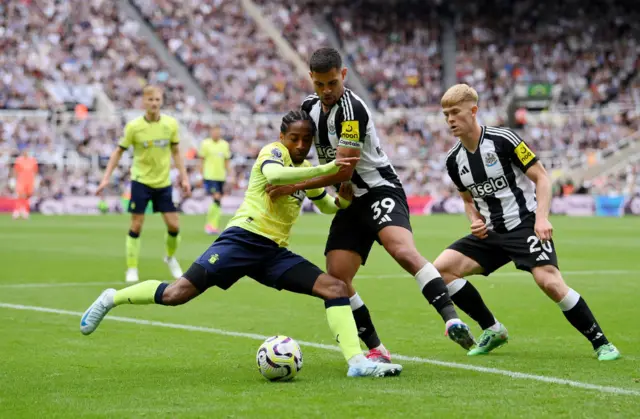 Walker-Peters struggles to fet a cross into the box