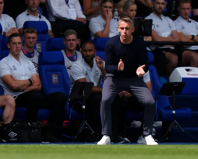 McKenna gestures instructions from the sideline.