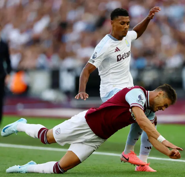 Mavropanos in action with Aston Villa's Ollie Watkins