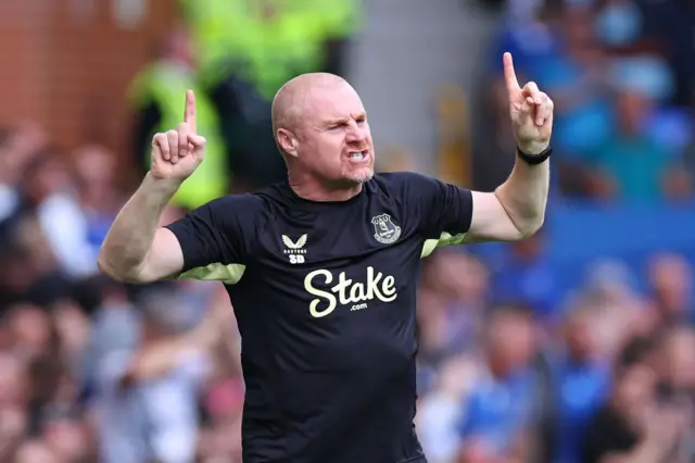 Dyche gestures instructions from the touchline