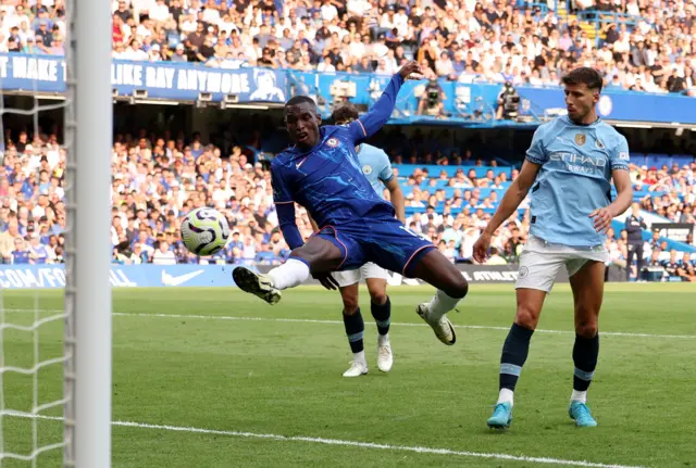 Jackson prods the ball at goal from four yards out