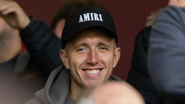 Former Motherwell midfielder David Turnbull watches on