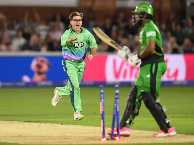 Adam Zampa celebrates with a clenched fist