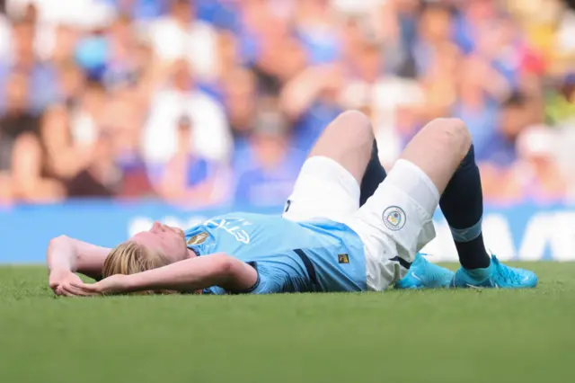 De Bruyne lies on the floor