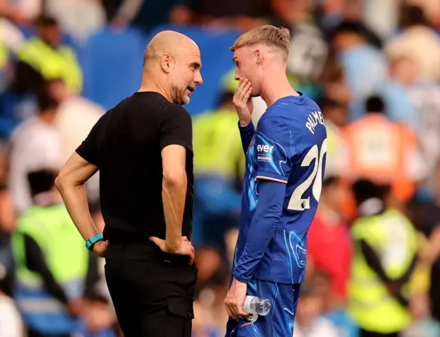 Guardiola chats to Palmer