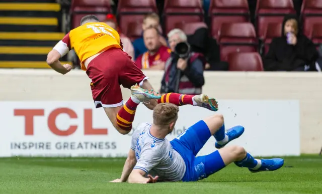 Stuart Findlay tackles Paul McGinn