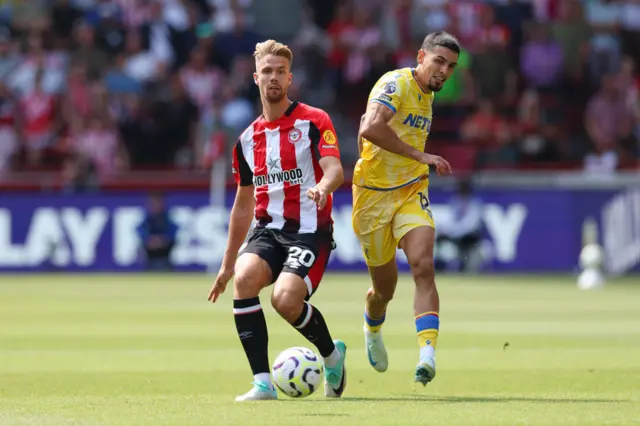 Kristoffer Ajer of Brentford and Daniel Munoz of Crystal Palace battle for possession during the Premier League match