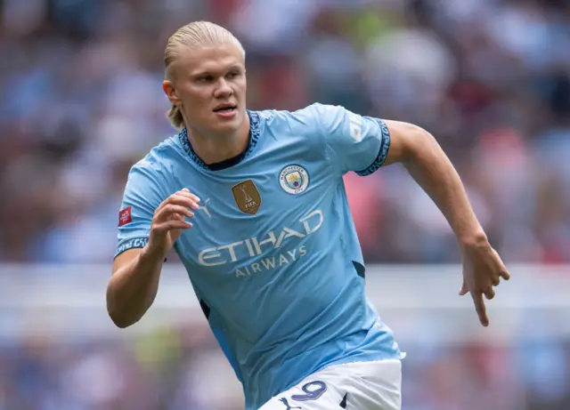 Haaland runs during the community shield v Man Utd