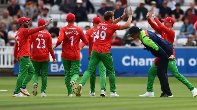 Leicestershire celebrate the wicket of Andy Umeed