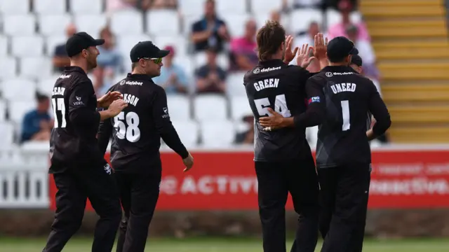 Ben Green celebrates taking a wicket