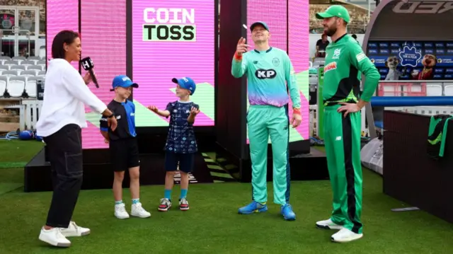 Sam Billings, Captain of Oval Invincibles flips the coin as James Vince, Captain of Southern Brave looks on during The Hundred Final match between Oval Invincibles Men and Southern Brave Men