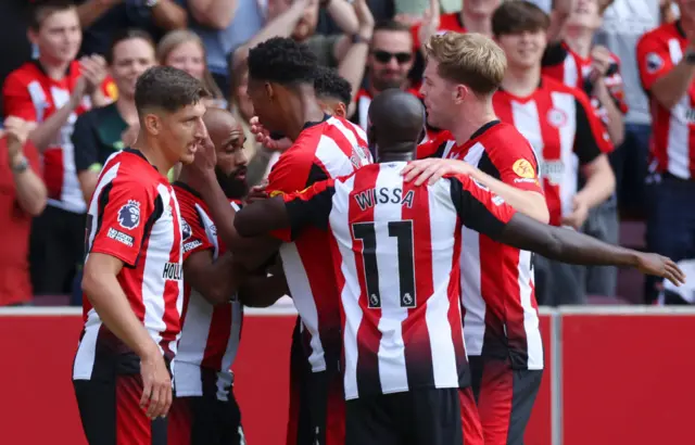 Brentford players celebrating their goal