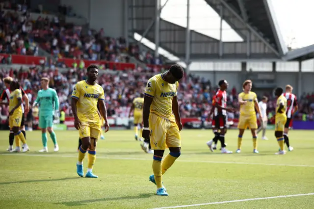 Guehi leads the Palace team over to clap the away end for their support at full time