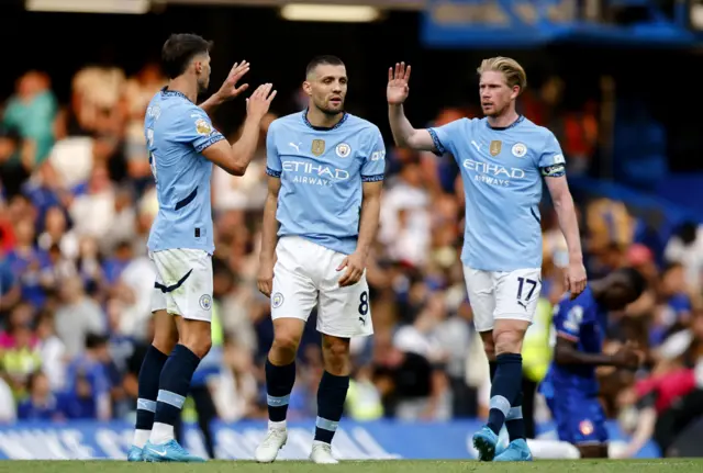 Kovacic, De Bruyne and Dias celebrate at full time