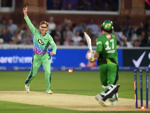 Adam Zampa claims a wicket against Alex Davies