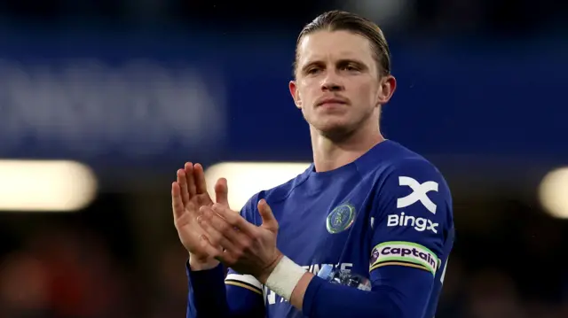 Conor Gallagher applauds the Chelsea fans