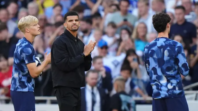 Dominic Solanke applauds the Tottenham fans