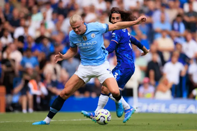 : Erling Haaland of Manchester City under pressure from Marc Cucurella