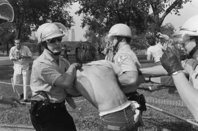 Police arrested a protester at the 1968 DNC.