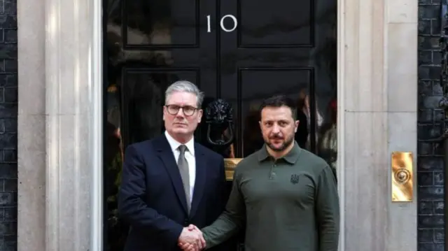 UK PM Sir Keir Starmer shakes hands with Ukrainian President Volodymyr Zelensky in front of 10 Downing Street