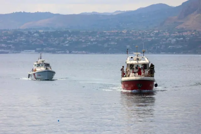 Two rescue boats move on the surface of the sea