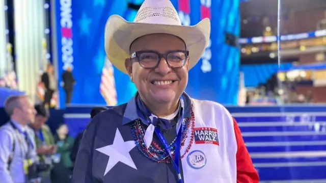 A Texas delegate poses for a photo inside the Democratic National Convention